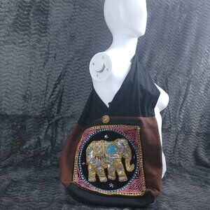 Sling Body Purse With Elephant Design On The Front.